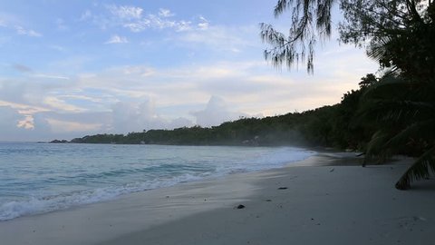 Waves at sunrise on the beach Anse Lazio. Island of Praslin in Seychelles.