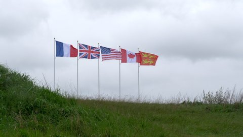 Flag of France next to its western allied countries United Kingdom, United States of America, Canada waving beside Normandy flag, all involved in Operation overlord, D-day