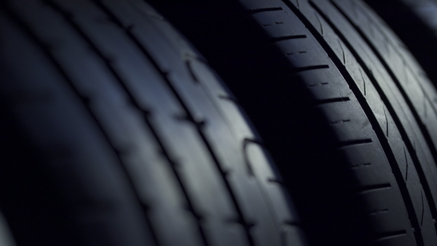 Closeup of car tires background video Royalty-Free Stock Footage #1058603725