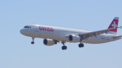 LISBON, PORTUGAL - 2020: Swiss Airlines Airbus A321 Jet Airliner Landing on Runway Arriving at Lisbon Portugal Humberto Delgado Portela LIS International Airport Touching Down with Tire Smoke