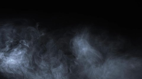 Abstract white smoke in slow motion. Smoke, Cloud of cold fog in light spot background. Light, white, fog, cloud, black background, 4k, ice smoke cloud. Floating fog.: stockvideo