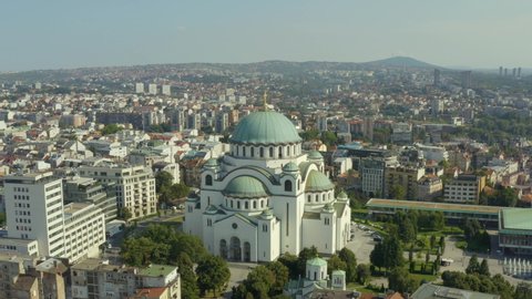 Aerial shot Belgrade Serbia. flight on a drone over the Cathedral of St. Sava with domes, houses and streets on the background and a beautiful landscape.