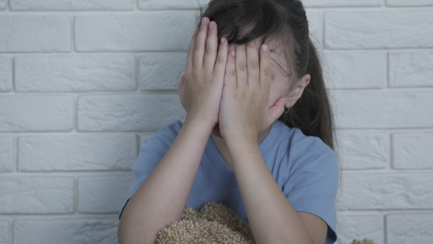 Punished child. A view of punished child with her teddy bear in the room. | Shutterstock HD Video #1058623768