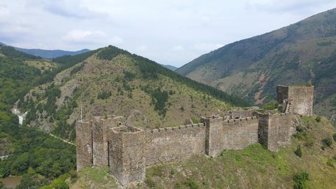 Aerial view of Maglic medieval fortress. The castle is located a top a hill around which the Ibar river in Serbia. The fortress consist of seven towers and one dungeon tower connected with walls