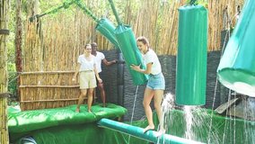 Obstacle course over the water - fun adventure in an amusement park - Powered by Shutterstock - Get 15% off with code: PIKWIZARD15