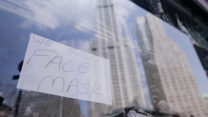 A sign in the window of a store