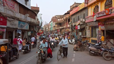 Varanasi, India - Circa October 2019. Road traffic on the crowded streets of Varanasi.