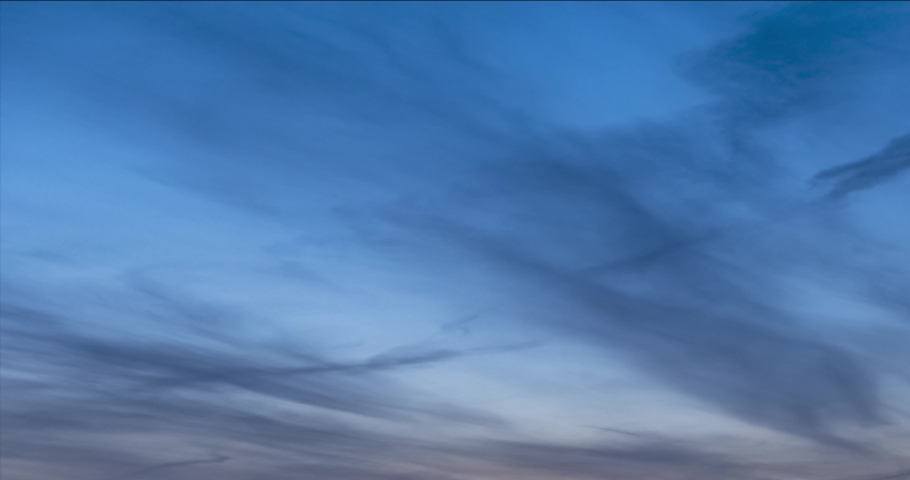 4K UHD flat hill meadow timelapse at the summer or autumn sunrise time. Wild nature and rural field. Sun rays, trees, green grass movement. Motorised dolly slider