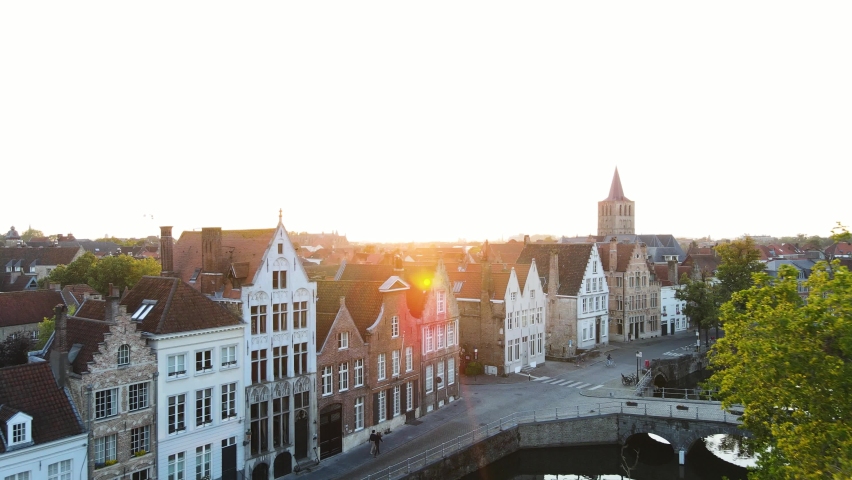Bruges, Belgium - drone shot of the cityscape while sunset. Royalty-Free Stock Footage #1058654677