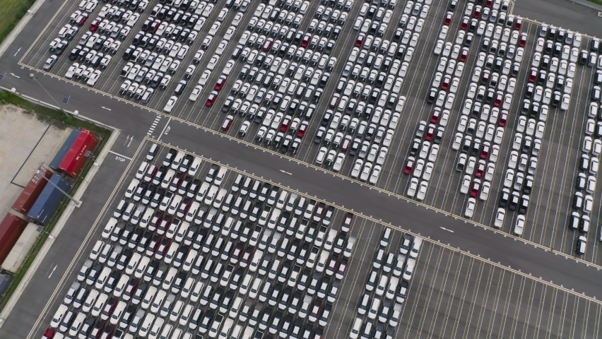Aerial top view of new cars parking for sale stock lot row, dealer inventory import and export business commercial worldwide, Automobile and automotive industry distribution logistic global transport Royalty-Free Stock Footage #1058655406