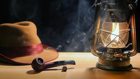 footage of smoking pipe hat lamp