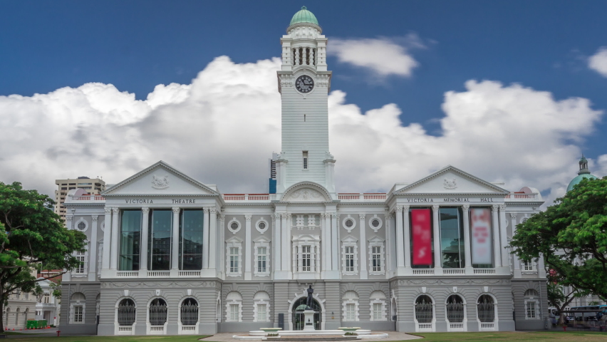 The Victoria Theatre and Concert Hall is a performing arts center in the Central Area of Singapore timelapse hyperlapse. Statue of Sir Stamford Raffles outside of entrance.
