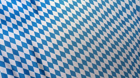 Full frame Bavarian blue white German Munich Oktoberfest pattern concept template. Cloth fabric waving 3D animation. Seamlessly looping copy text background with Bavaria State flag fabric table cloth.