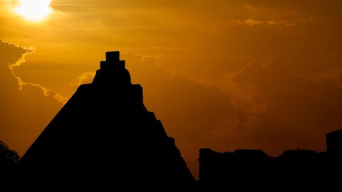 Mayan Pyramid of the Magician in Uxmal, Time Lapse at Sunset with Red Sun and Fiery Clouds, Mexico