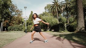 Black woman dancer in park, african american woman dancing hip-hop, outdoor training dance