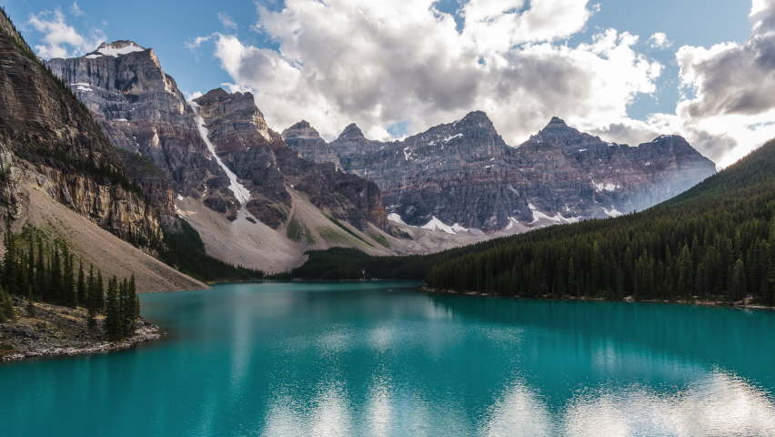 Moraine Lake and Valley of the Ten Peaks at sunset, Banff National Park, Alberta, Canada, zoom out time lapse.