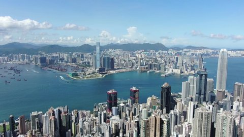 Hong Kong skyline with skyscrapers and bay view on a beautiful clear day, Aerial view.