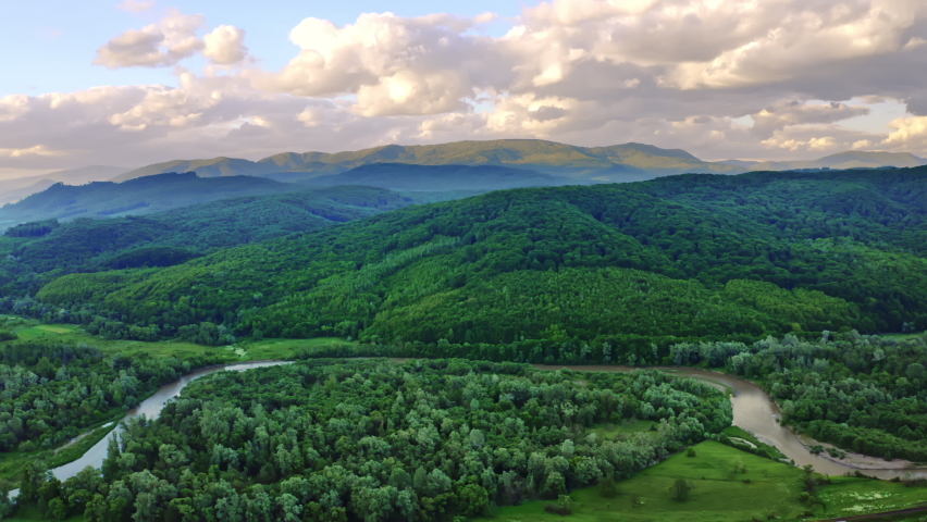aerial view on river bend mountain landscape amazing deciduous forest and sky with clouds