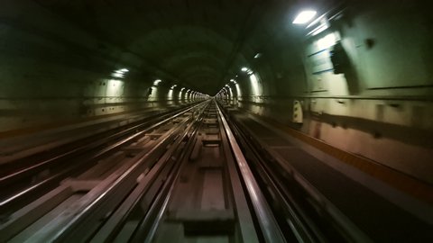 Hyperlapse POV Train riding in the subway tunnel. Time lapse of automatic train moving to tunnel