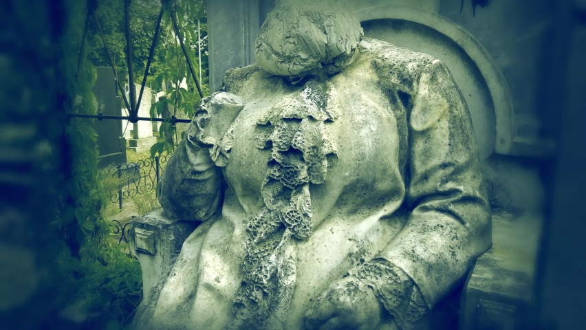 Ancient architectural tombstone of praying woman without head. background for horror