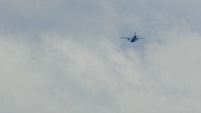 Military two engine plane flying far away on a cloudy day. - Powered by Shutterstock - Get 15% off with code: PIKWIZARD15