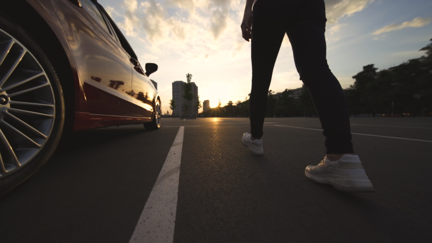 The woman walks through the parking lot