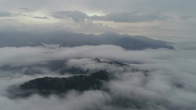
Mountains in Montenegro. Green forest in the hills. Beautiful landscape. Piva Canyon, Pluzine. Drone video. Beautiful water. Turquoise water. Summer. Fog. higher than clouds