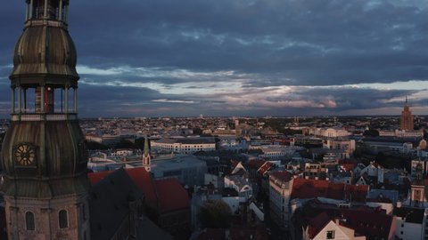 Beautiful evening over Riga old town, the capital of Latvia. Aerial Riga view from above with old buildings and Dome's cathedral.