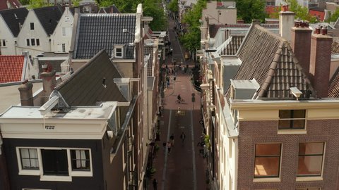 Slow forward Aerial through typicall Amsterdam Street