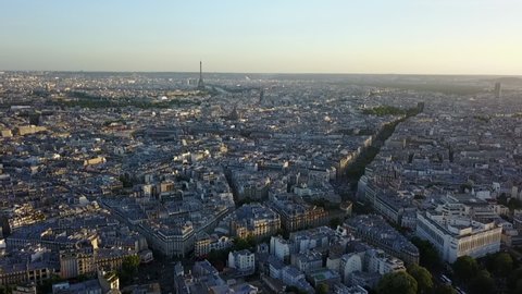 AERIAL: Over Paris looking towards Eiffel Tower at Sunset 