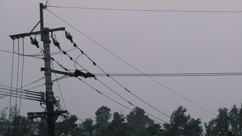 Telephone poles and electric wires swaying in strong typhoons