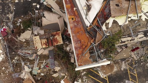 Rubble and debris on roof top from tornado disaster 4k