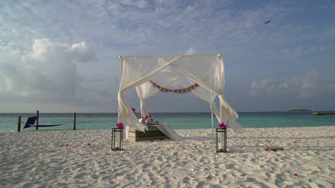 white arch with tropical beach and sea in Maldives