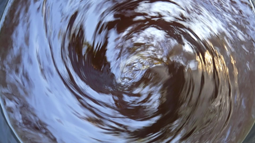 Moving Water spins into a whirlpool, Top view Out of focus. Royalty-Free Stock Footage #1058751772