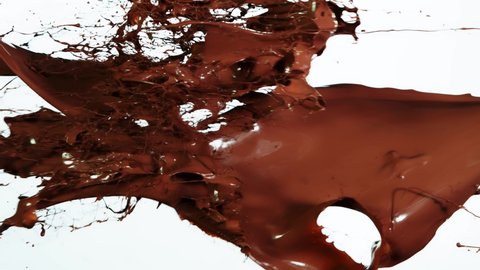 Super Slow Motion Shot of Chocolate splash on White Background at 1000fps.