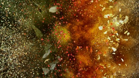Super Slow Motion Shot of Colorful Seasoning Explosion on Black Background at 1000fps.