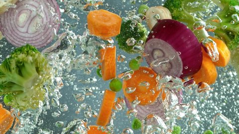 Fresh vegetables in boiled water in pot shooting with high speed cinema camera at 1000 fps.