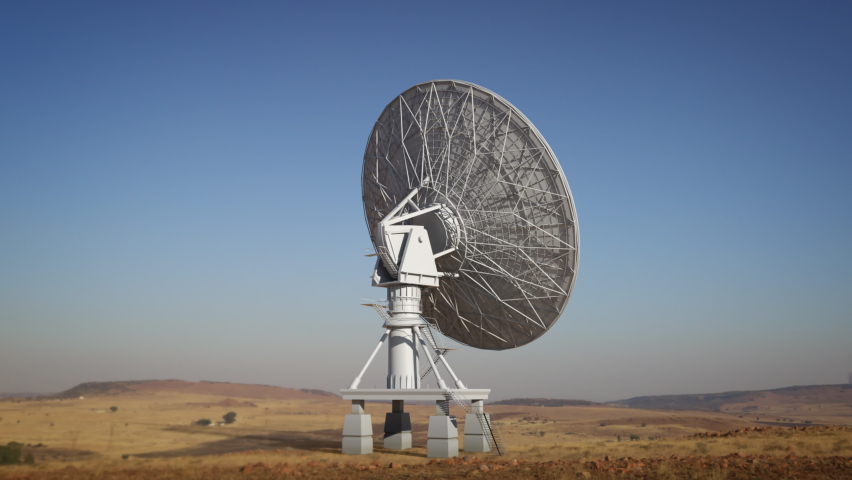 Large ground satellite isolated on desert environment, big satellite dish rotating in loop searching the sky during day. Royalty-Free Stock Footage #1058779006