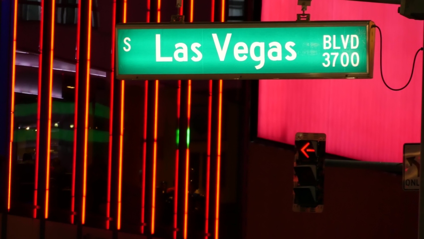 Fabulos Las Vegas, traffic sign glowing on The Strip in sin city of USA. Iconic signboard on the road to Fremont street in Nevada. Illuminated symbol of casino money playing and bets in gaming area.