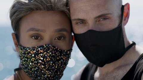 Safety on the beach. An LGBTQ couple wearing masks on the beach. Love and fun while being safe during the global pandemic. Shot in 4k!