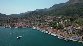 Aerial drone video of picturesque village capital and port of Ithaki or Ithaca island called Vathi a safe anchoring for sail boats, Ionian, Greece