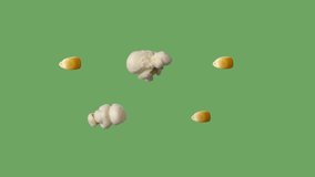 Multiple popcorn kernels popping on chroma green screen. - Powered by Shutterstock - Get 15% off with code: PIKWIZARD15