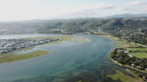 River lagoon and surrounding green hills of Knysna, South Africa aerial