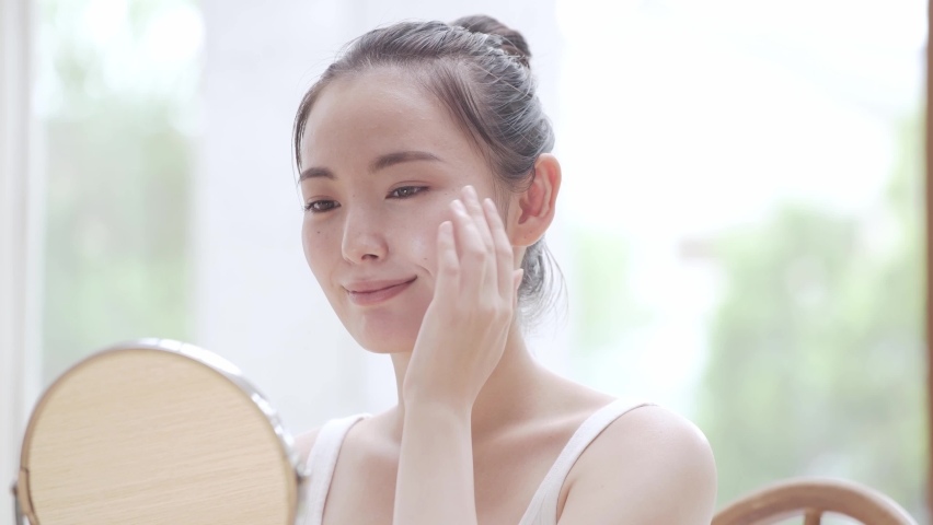 Young woman doing skin care | Shutterstock HD Video #1058813068
