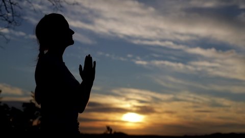 Silhouette Woman Praying Amazing Dramatic Sky Stock Footage Video (100% 