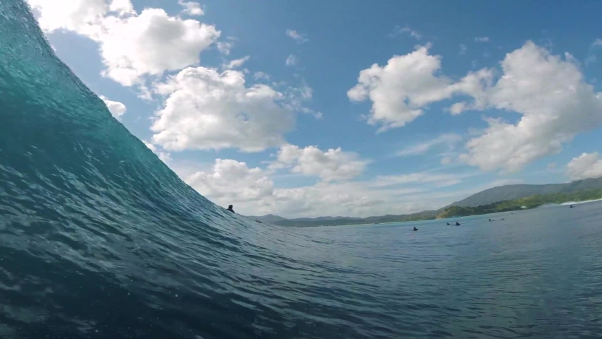 Vision from the inside of a perfect wave surfing the tube | Shutterstock HD Video #1058816752