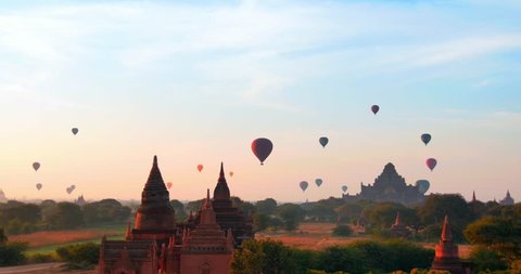 Panoramic view of Bagan historical site in Myanmar (Burma). Hot air balloons fly over ancient temples and Buddhist pagodas