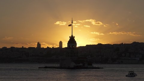 Maiden Tower / Kiz Kulesi at beautiful sunset. Sunset panorama clip taken at Bosphorus, in Uskudar region of Istanbul, Turkey