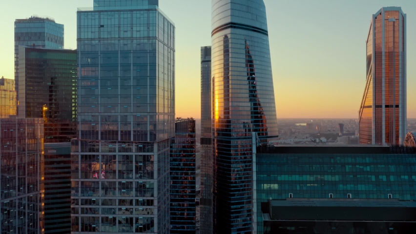 Aerial shot of futuristic Moscow International Business Center at sunset. Financial district skyscrapers. The concept of success. the camera is going backwards.High quality 4k footage Royalty-Free Stock Footage #1058827651