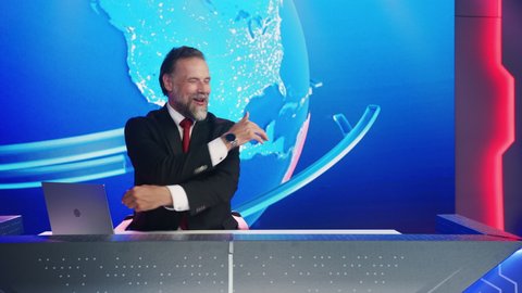 Live News Studio with Charismatic Male Newscaster Having Fun. Talk Show Host Telling Joke and Laughing. TV Broadcasting Channel with Presenter, Anchor Talking. Mock-up Television Channel Newsroom Set